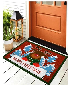 Detail der roten Merry Christmas Anti-Rutsch-Türmatte mit gebürsteter Textur auf Holz