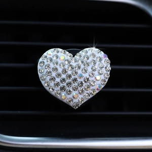 Sparkling crystal heart-shaped car air vent clip with rhinestones and white base