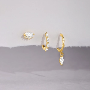 Detailed view of gold S925 sterling silver hoop earrings set with marquise cz crystals