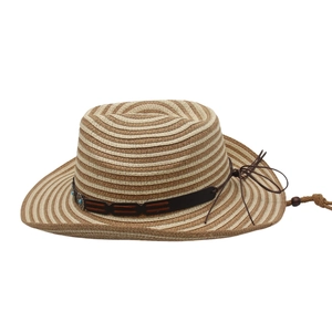 Close-up of woven straw hat with turquoise beads, leather band and chin strap detail