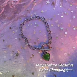 Silver-colored heart pendant bracelet with temperature color-changing feature and OT clasp