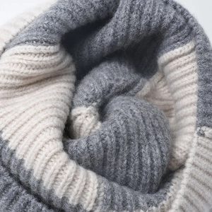 Unisex grey and off-white striped wool knitted beanie with thick ribbed texture