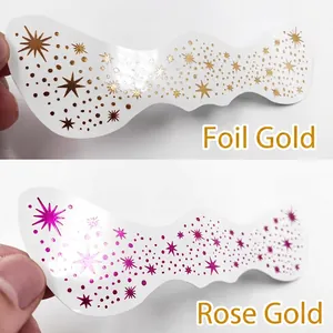 Waterproof gold and rose gold freckle face tattoos with metallic stars for party makeup