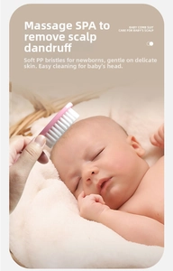 Gentle baby hair brush with soft bristles massaging a sleeping newborn's head