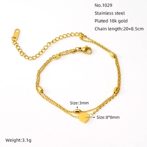 Macro shot of 18K gold plated stainless steel double layer heart anklet and small beads