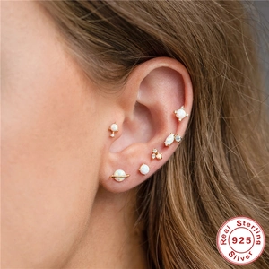 S925 sterling silver earring set with opal and cubic zirconia on female model