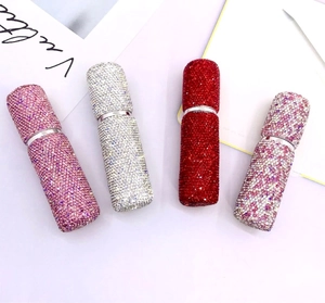 Detail view of four 10ml refillable rhinestone perfume bottles in pink, silver and red colors