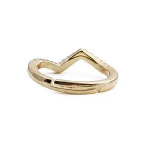 Minimalist wavy heart ring in gold with rainbow cubic zirconia on a white background