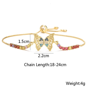 Detail of 18K gold butterfly bracelet with blue and white zircons and size dimensions