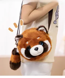 Detail of red panda plush crossbody bag with striped tail and braided strap on model