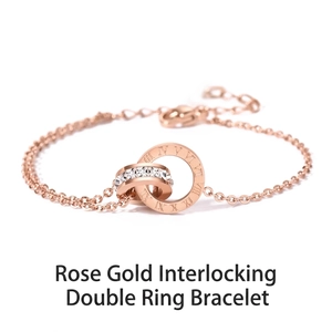 Détails du bracelet double anneau romain en or rose avec des pierres scintillantes