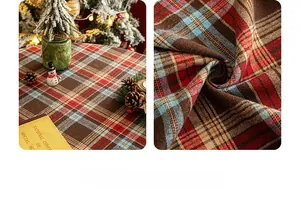 Close-up of red and green plaid tablecloth fabric texture with festive Christmas props