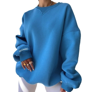 Oversized blue crewneck sweatshirt with dropped shoulders and white letter print