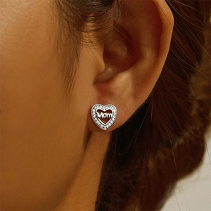 Close-up of S925 sterling silver heart stud earrings with pavé diamonds and Mom text