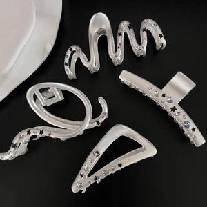 Matte silver star hair claws set with colorful rhinestones in various geometric shapes