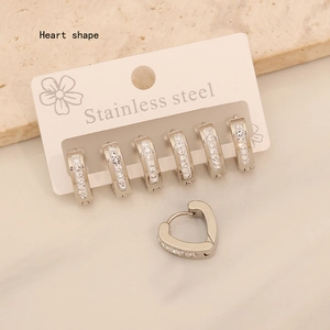 Detailed shot of stainless steel stud earring set with heart shape and round crystals