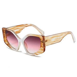 Fashionable cat eye sunglasses with ivory and amber frame and purple gradient lenses