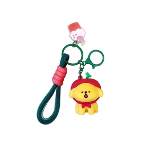 Cute 3D yellow dog keychain with red hoodie and green braided strap on white background