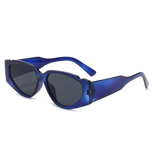 Fashionable oversized geometric cat eye sunglasses in translucent blue with grey lenses