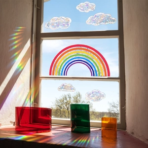 Rainbow and cloud prism window stickers creating colorful suncatcher light effects