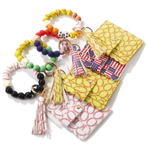 Macro view of silicone sport bead bracelets with leather card holders and tassels