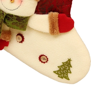 Cream fleece Christmas stocking with snowman design, green scarf and felt tree detail
