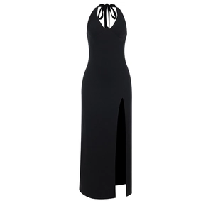 Detail showing the sexy halter neck and high side slit of the black maxi dress