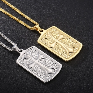 Detailed view of silver and gold square cross military pendants on twisted rope chains
