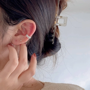 Irregular textured 925 sterling silver ear cuff and clear square hair clip on female model
