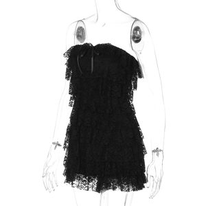 Detail of black lace layered strapless romper with a delicate ribbon bow on the neckline