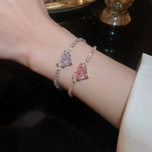 Detailed shot of sparkling silver and gold heart bracelets with micro-pave cubic zirconia
