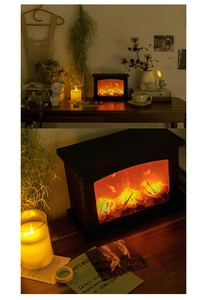 Macro view of LED faux fireplace lamp showing dynamic flame effect and cozy warm light