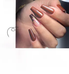 Deep coffee coffin press-on nails with shiny gold foil and aurora glitter detail