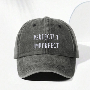 Detail shot of Perfectly Imperfect embroidery on vintage washed grey cotton baseball cap