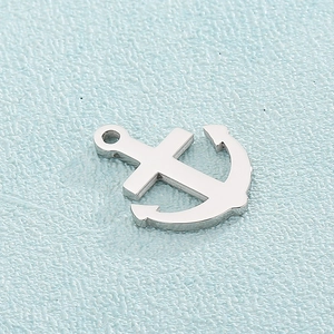 Macro view of a silver stainless steel anchor pendant for DIY jewelry making