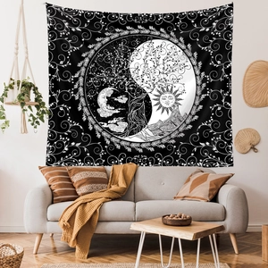 Close-up of black and white mandala tapestry featuring tree of life and yin yang patterns