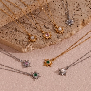 North Star pendant necklaces in gold and silver with zircon, pearl and emerald stones