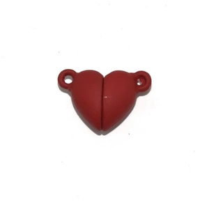 Close-up of matte red heart-shaped magnetic clasp jewelry connector with side rings