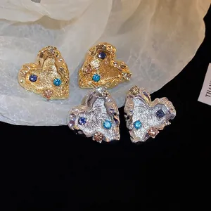 Lava texture heart earrings with colorful rhinestones in gold and silver finish