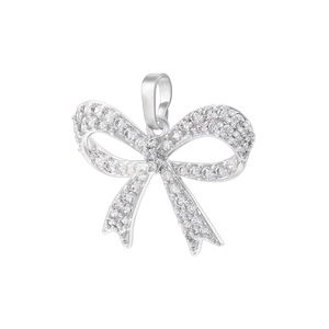 Detailed view of silver bow pendant with shimmering cubic zirconia and top hanging loop