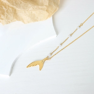 Elegant gold fishtail pendant necklace with natural white pearls on minimalist chain