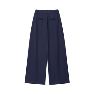 Detail of dark blue high-waisted wide-leg trousers featuring rear welt pockets and belt loops