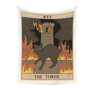 Close-up detail of tarot tapestry fabric with black cat and XVI The Tower illustration