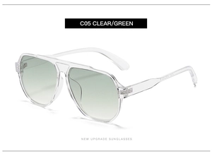 Detail view of transparent clear frame aviator sunglasses with green gradient lenses