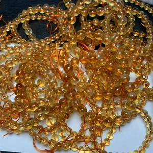Natural Brazilian citrine crystal bracelet featuring translucent amber round beads