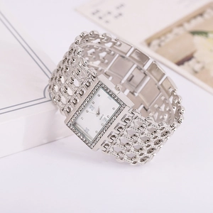 Detail of silver square dial watch with rhinestone bezel and hollow chain strap