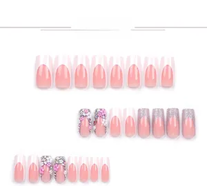 Detailed close-up of French tip nails with pink flowers and silver glitter accents