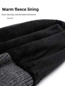 Detail of warm black faux fur lining and thick grey knit fabric on winter beanie