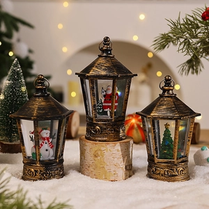 Vintage bronze Christmas lantern with LED lights featuring Santa, snowman, and tree figurines