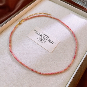 Detail view of natural stone square beads necklace with gold adjustable extension chain